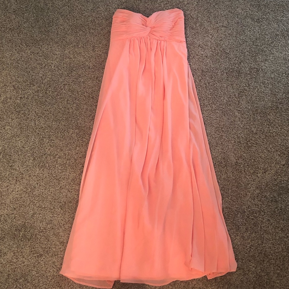 A coral long strapless dress